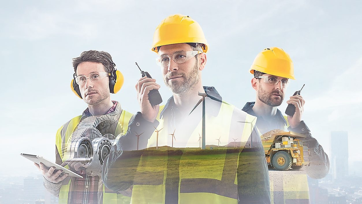 three workers on radios and reading documents, transposed over a background of blue sky with light clouds