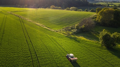 Tractor in field wide shot