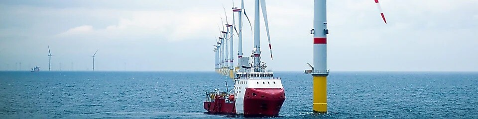 Offshore Support Vessel using biodegradable lubricants, VGP compliant and EU Ecolabel, whilst docking at an offshore wind turbine
