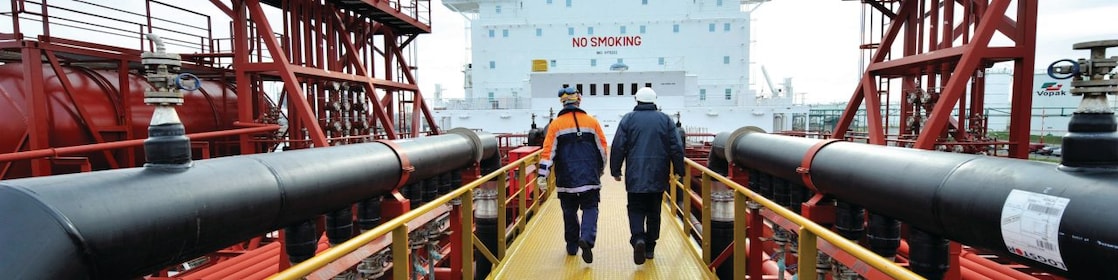 Shell employee walking along on a tanker