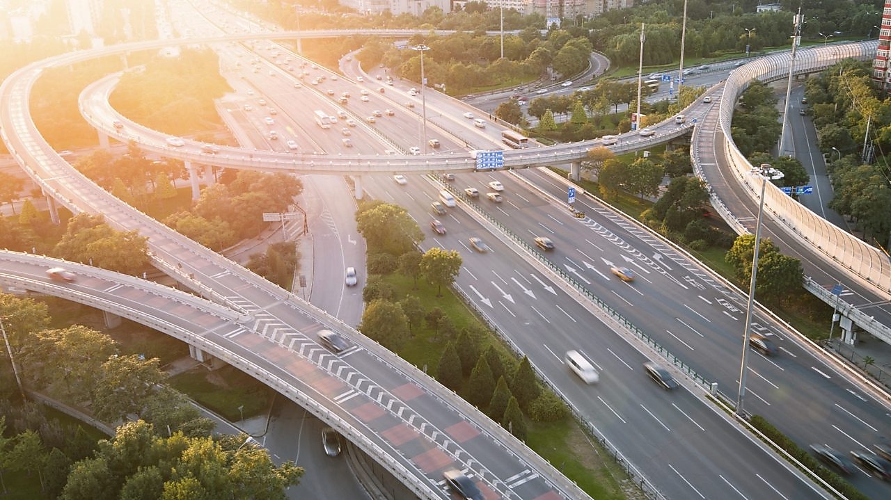 Cars driving on a complicated highway infrastructure with over and under passes